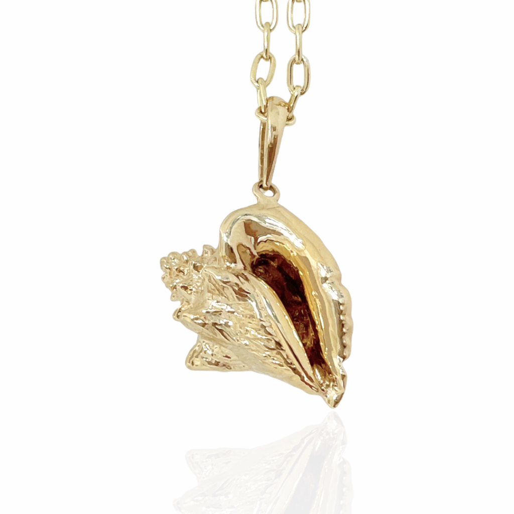 Gold conch shell on sale pendant